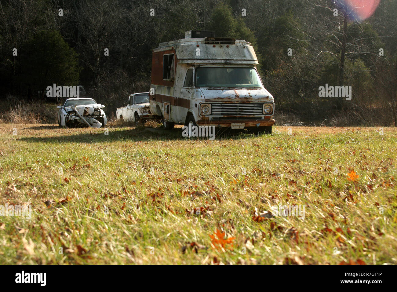 Old rusty vehicles abandoned in a field Stock Photo - Alamy