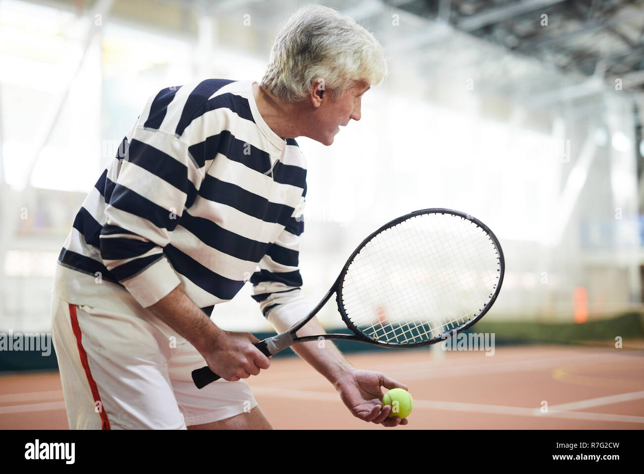 Aged tennis player Stock Photo