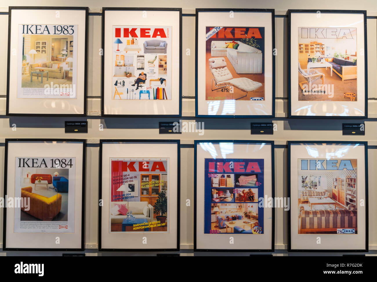 Valencia,Spain - December 09, 2018: Ikea store lot in Alfafar, Valencia. Exhibition of the old Ikea catalogs, framed on the wall. Vintage Ikea gallery Stock Photo