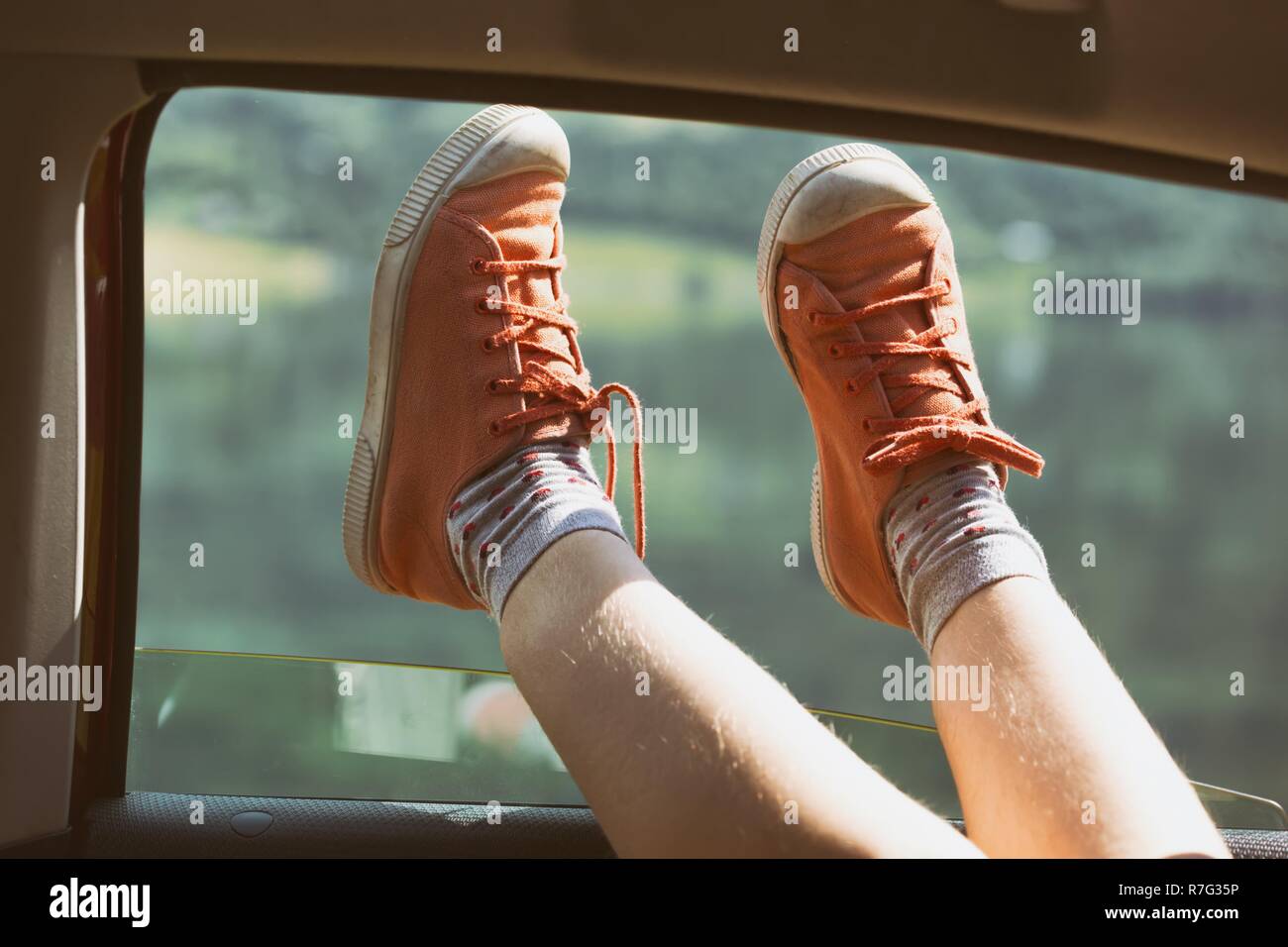 Legs sticking out of car hires stock photography and images Alamy