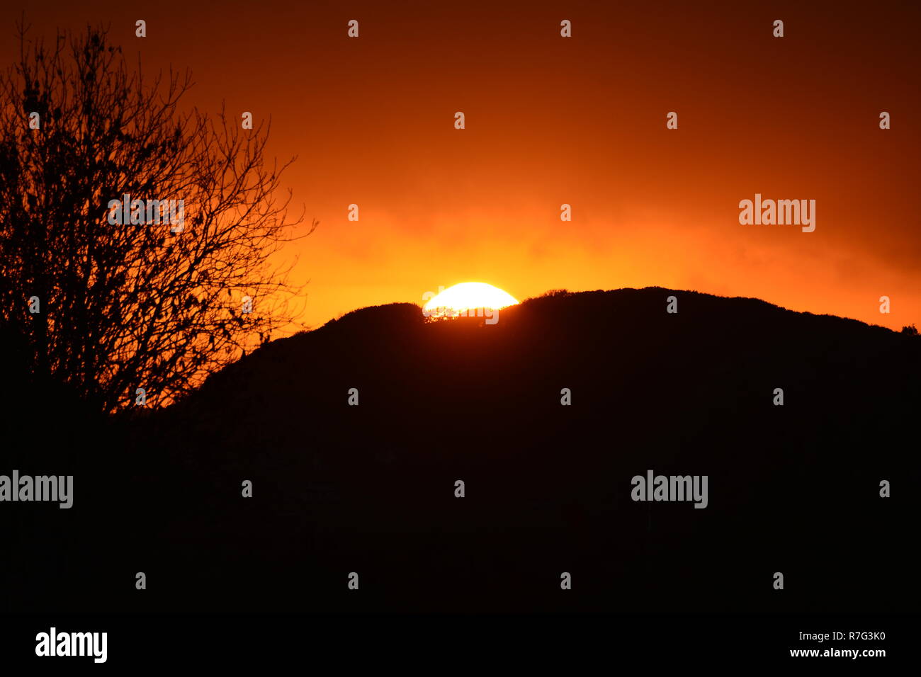 Sun Setting Behind Mountain 'Moel Y Geist' Stock Photo