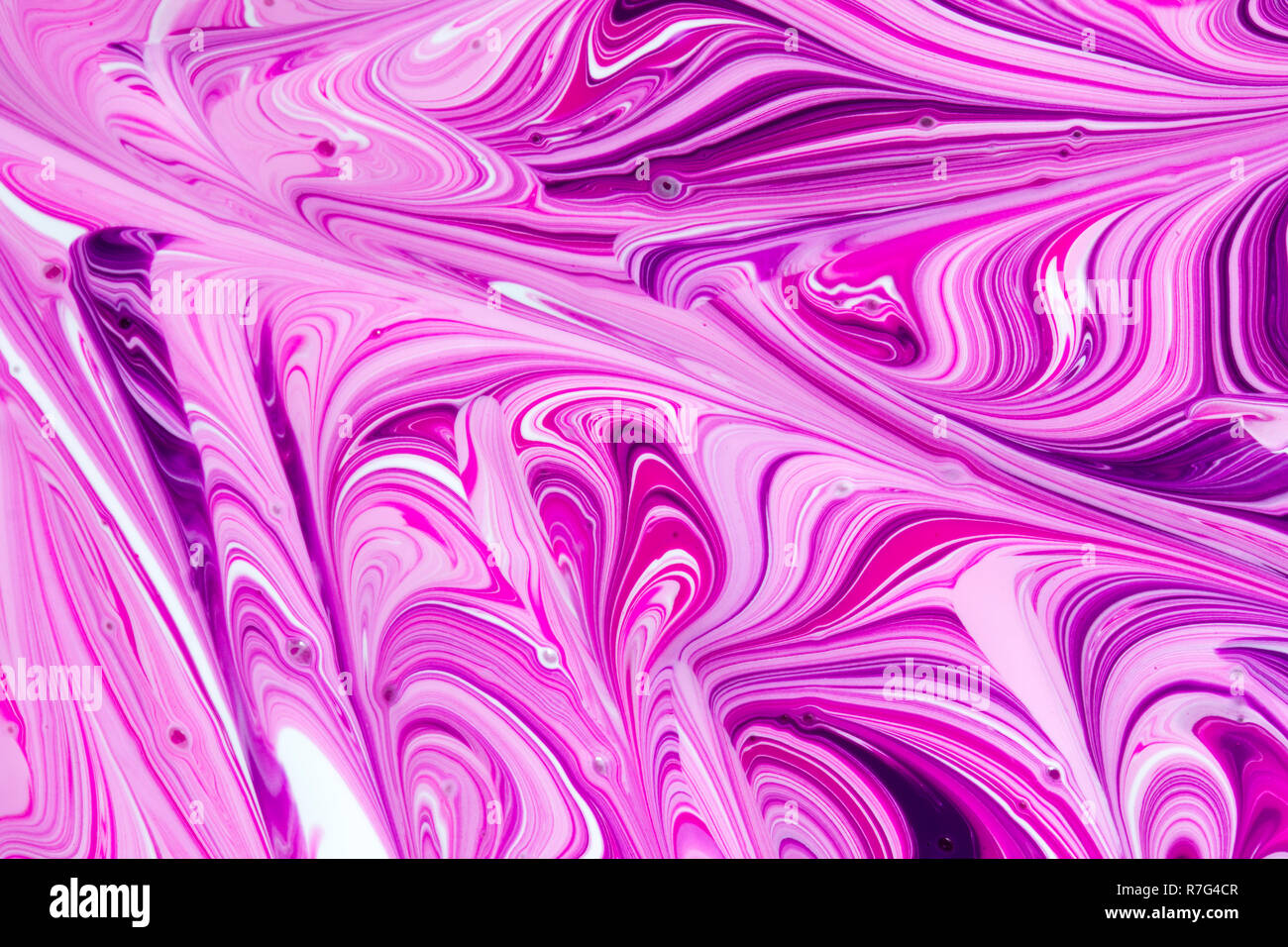 Abstract pink, white and purple liquid paint swirl background Stock