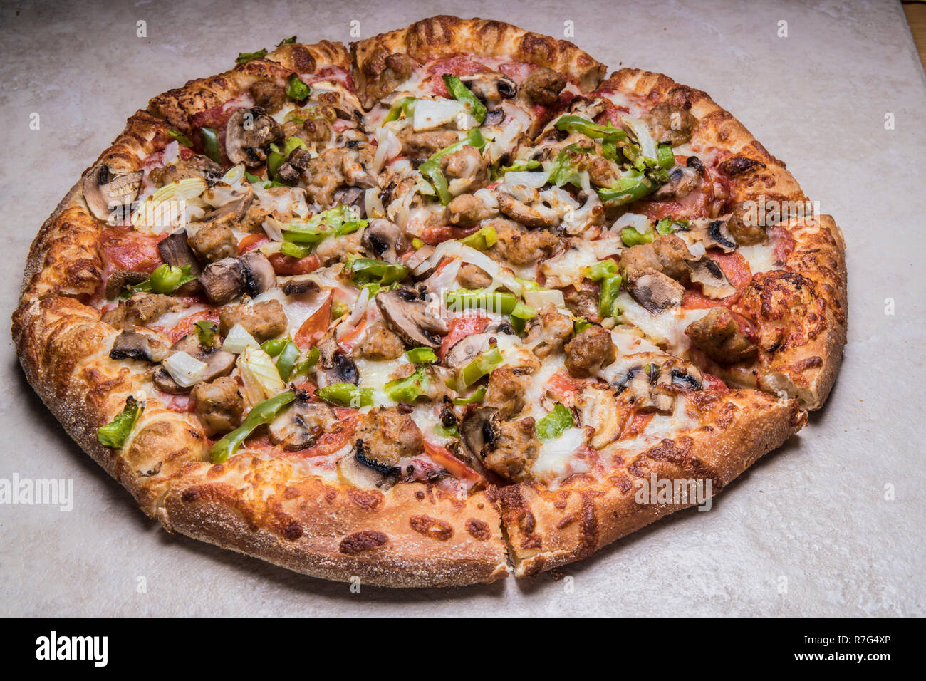 deluxe uno pizza with cheese,green peppers,italian sausage,mushrooms ...