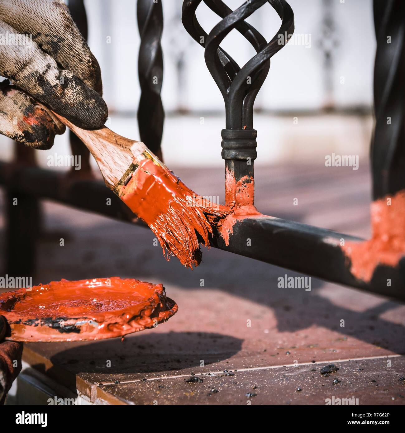 Painting metal products, protection against rust. Square format Stock Photo Alamy