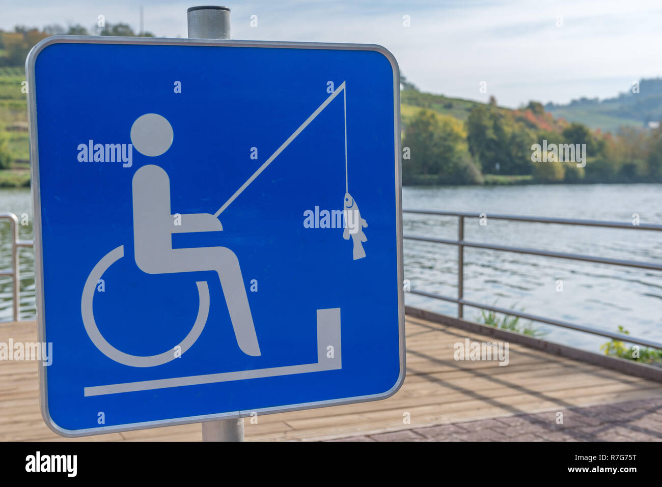 Sign allowing handicapped people to fish from the pier, Grevenmacher, Grand Duchy of Luxembourg, Europe Stock Photo