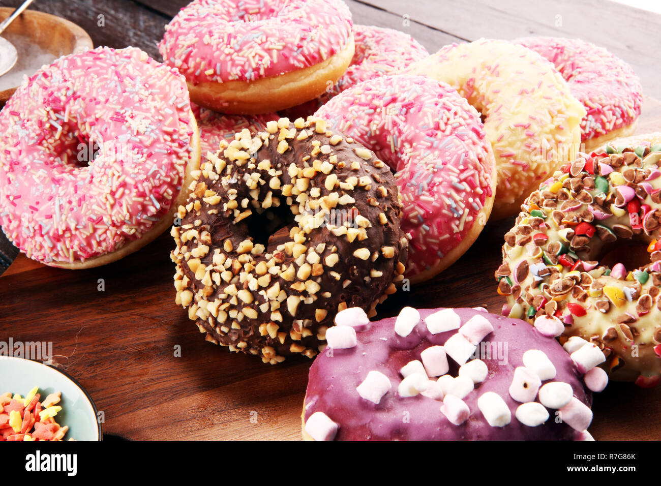 assorted donuts with chocolate frosted, pink glazed and sprinkles ...
