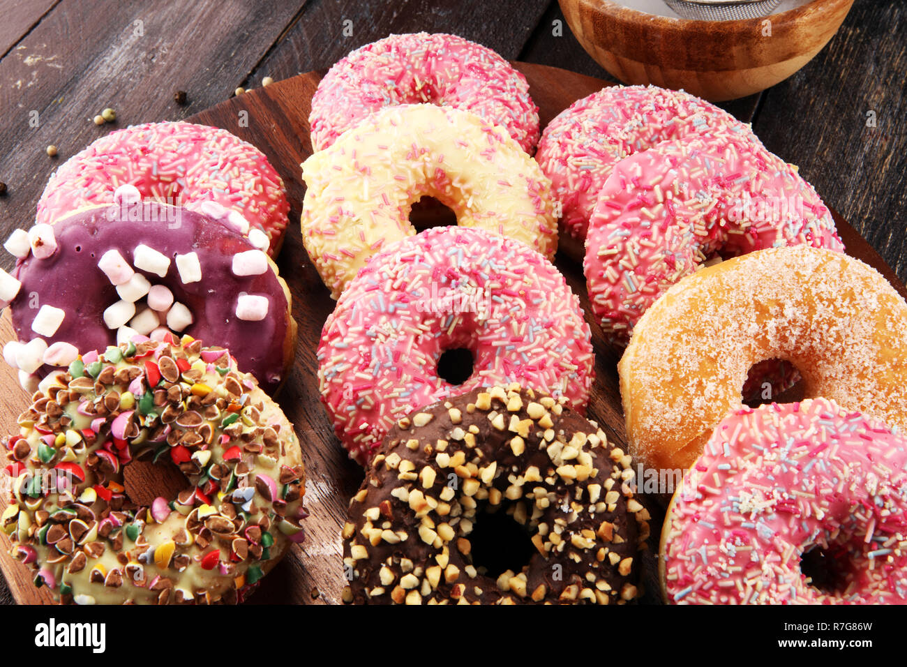 assorted donuts with chocolate frosted, pink glazed and sprinkles ...
