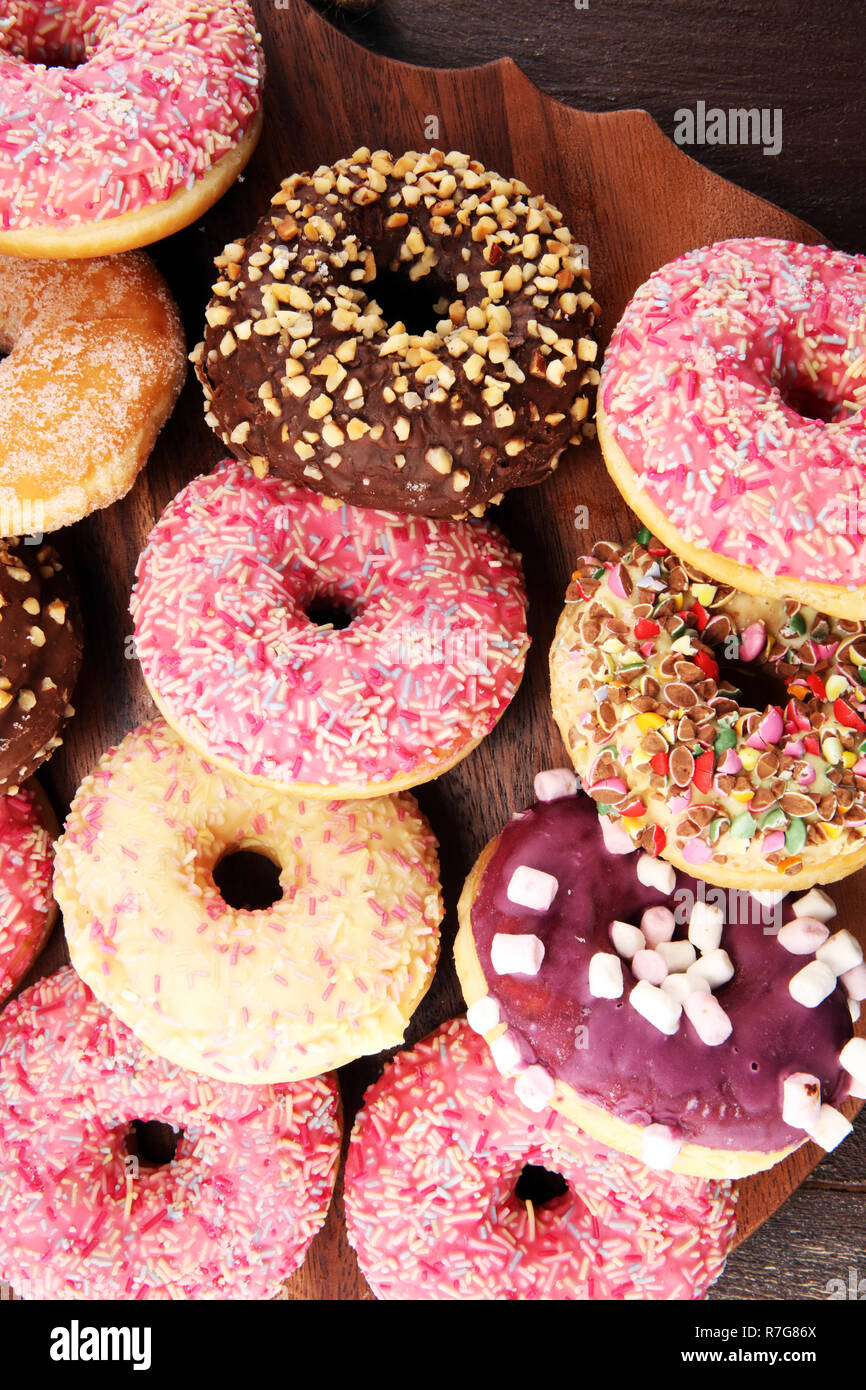 assorted donuts with chocolate frosted, pink glazed and sprinkles ...