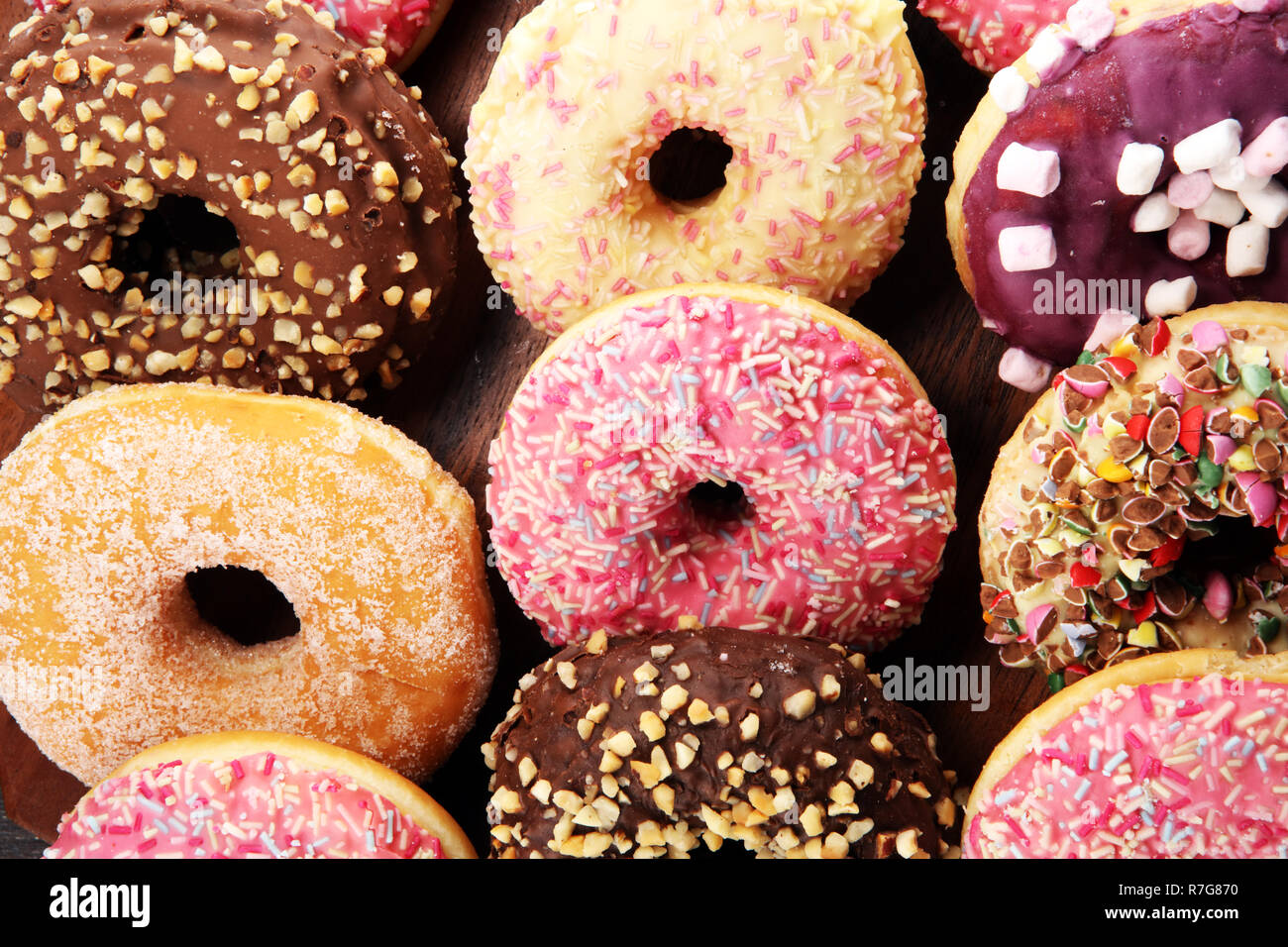 assorted donuts with chocolate frosted, pink glazed and sprinkles ...