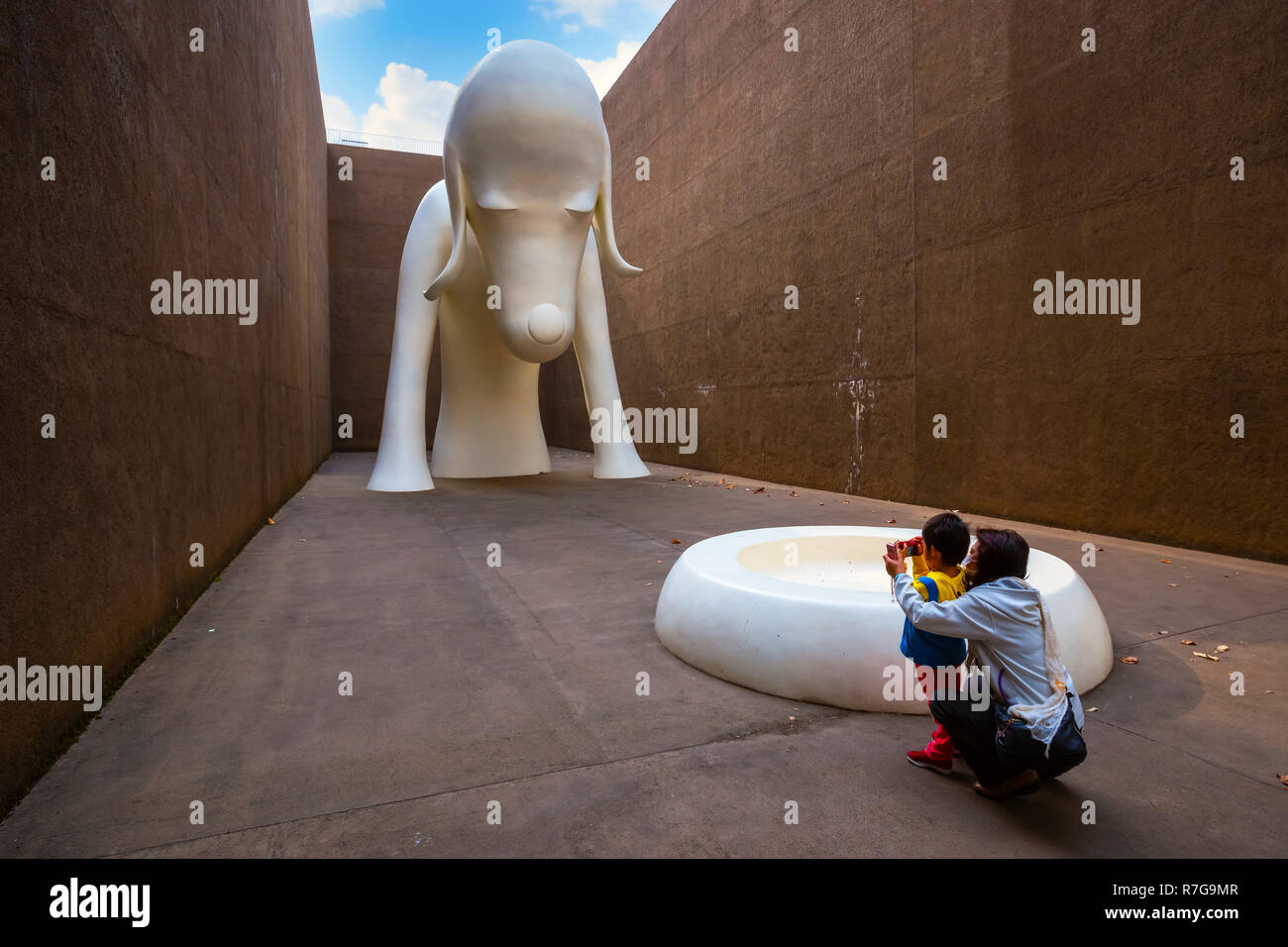 Tokyo, Japan - April 22 2018:  Aomori Dog Statue a gigantic white dog over 8.5 meters tall at The Aomori Museum Stock Photo