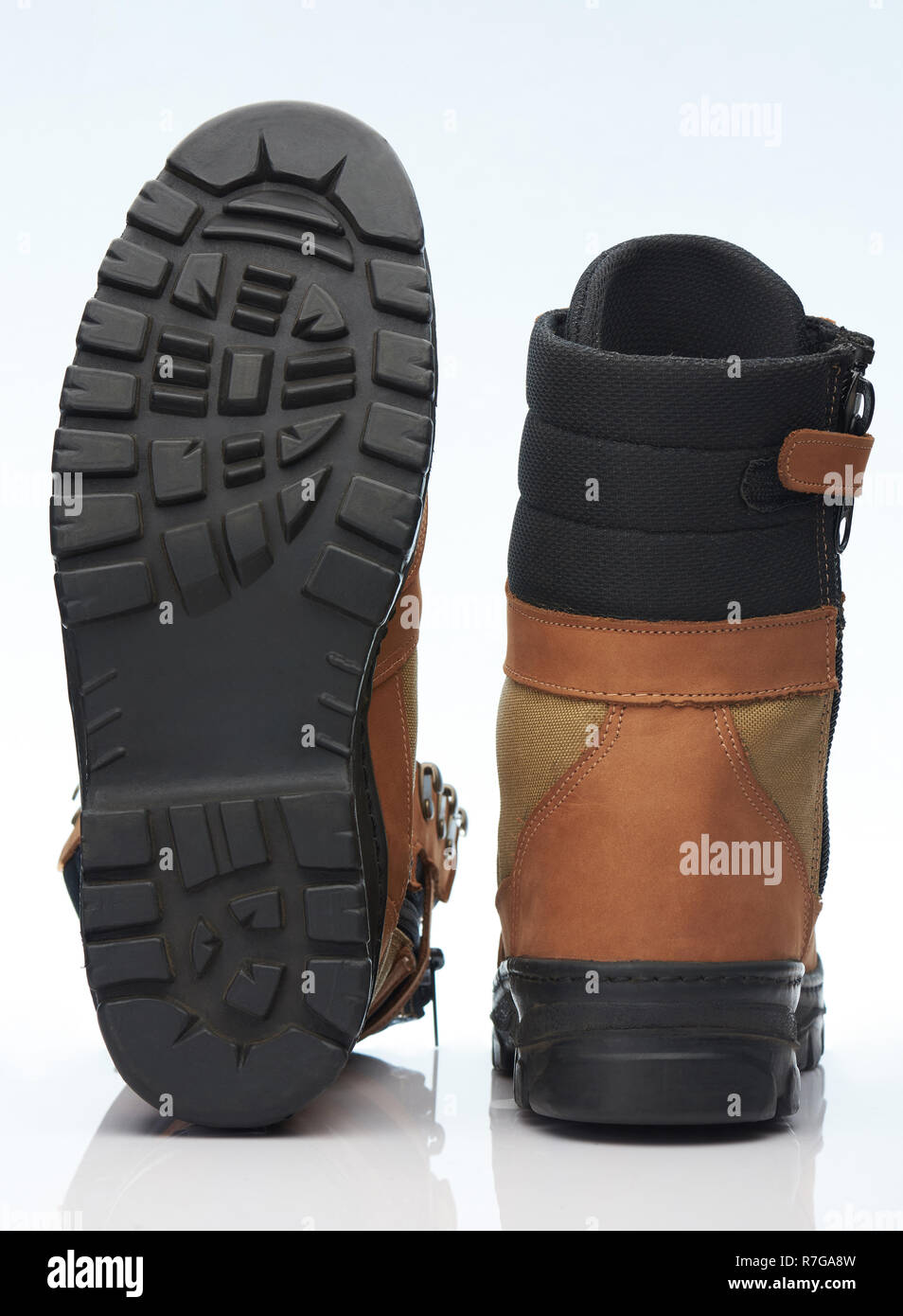 Brown military shoes bottom and back view isolated on white background