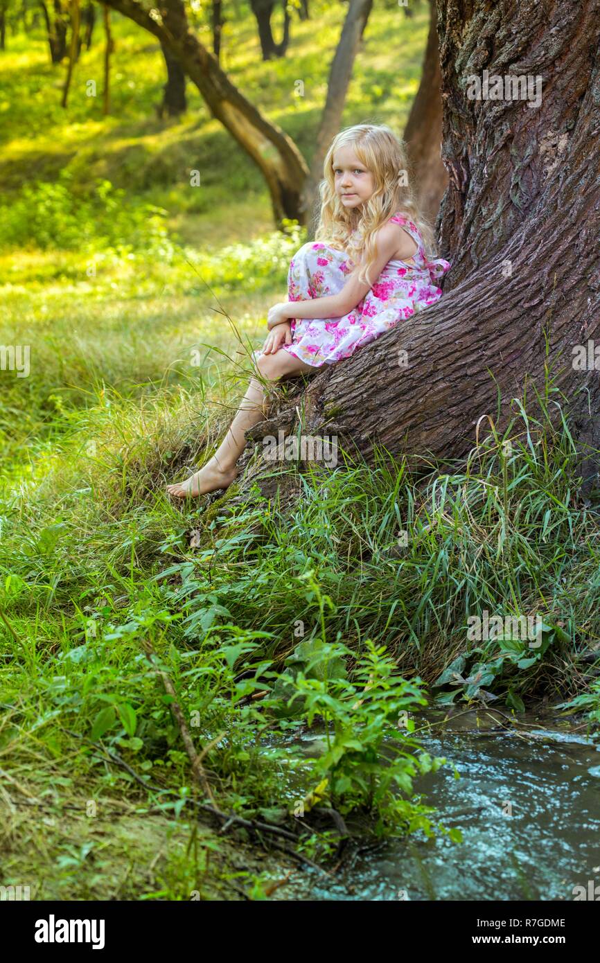 little girl in the forest, summer Stock Photo - Alamy