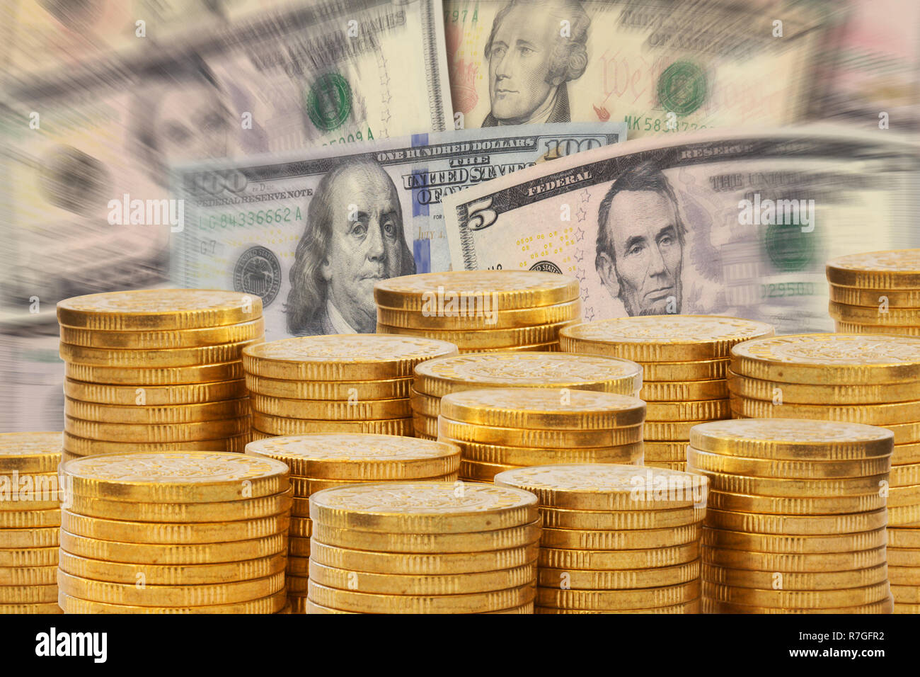 Golden money stacks in front of a pile of Dollar bank notes. Euro money and  finance concept Stock Photo - Alamy