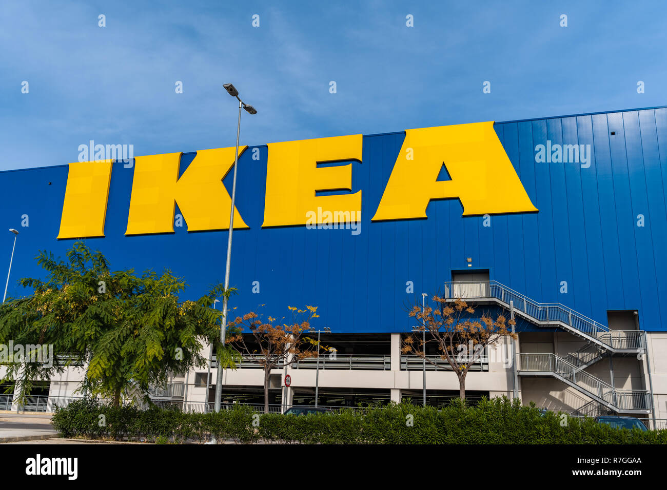 Valencia,Spain - December 09, 2018: Ikea store lot in Alfafar, Valencia. Huge  yellow Ikea word on blue background. Blue skyes on the top. Exterior vi Stock Photo