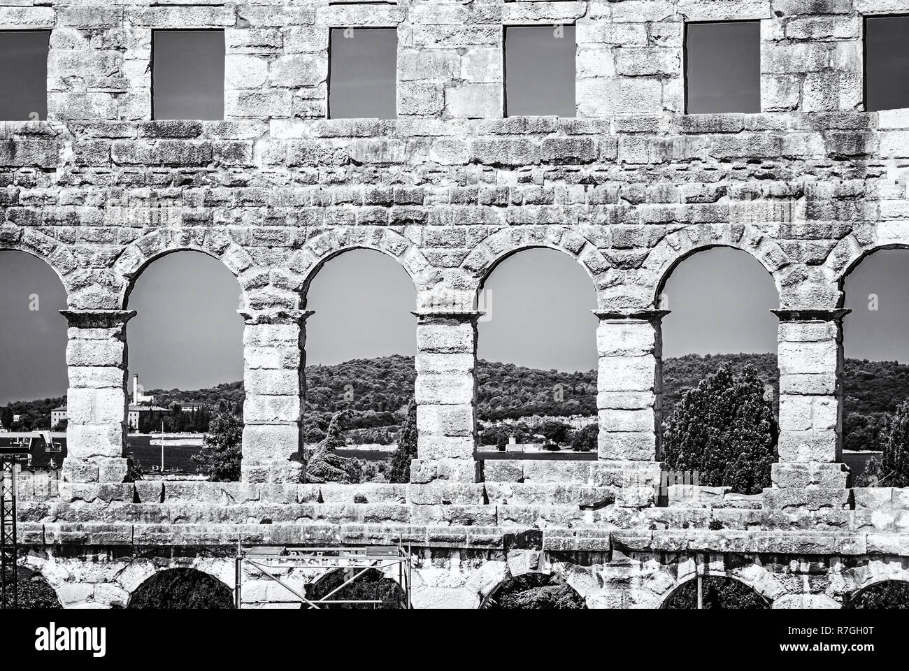 Detail photo of Pula Arena, Istria, Croatia. Travel destination. Ancient architecture. Black and white photo. Stock Photo