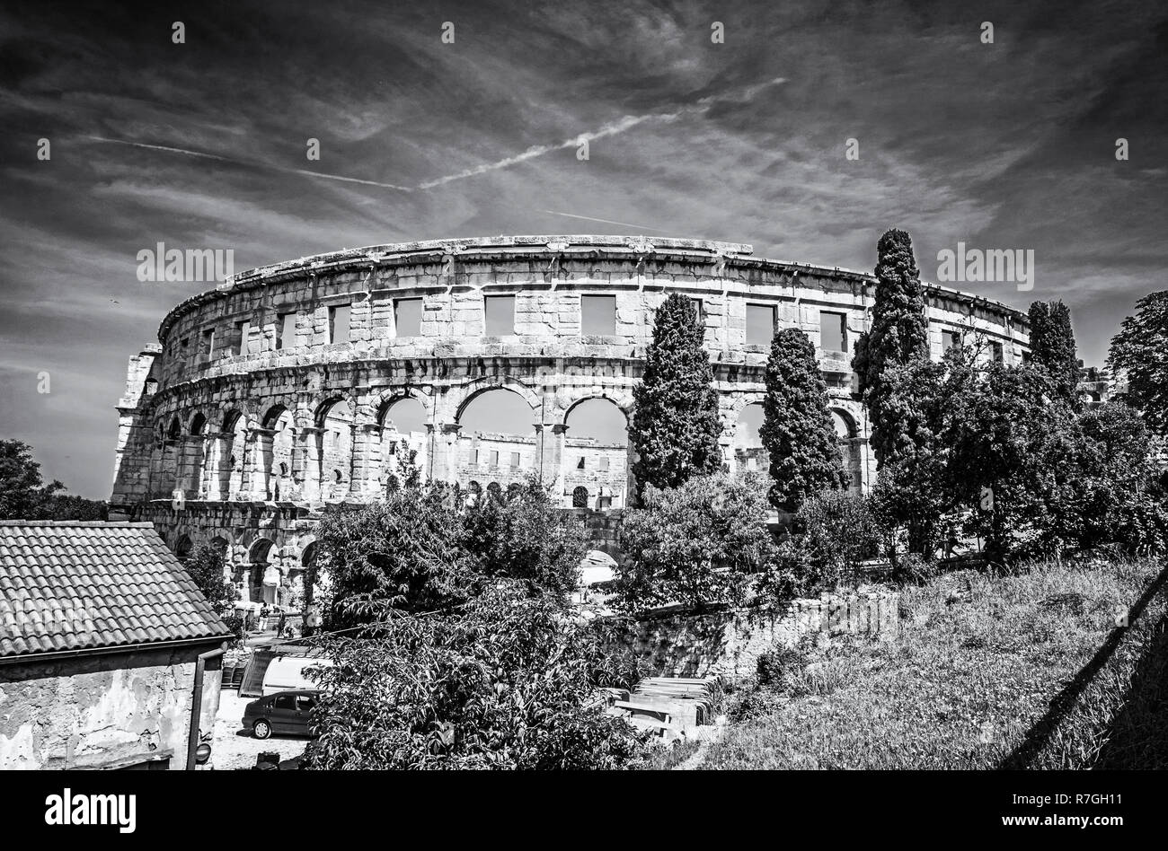 Ancient amphitheater located in Pula, Istria, Croatia. Travel destination. Famous object. Black and white photo. Stock Photo