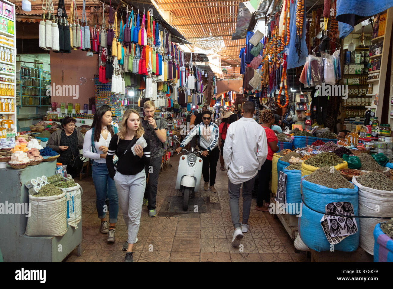 Marrakesh souk - tourists and local people shopping in the crowded souks, Marrakech, Morocco North Africa Stock Photo
