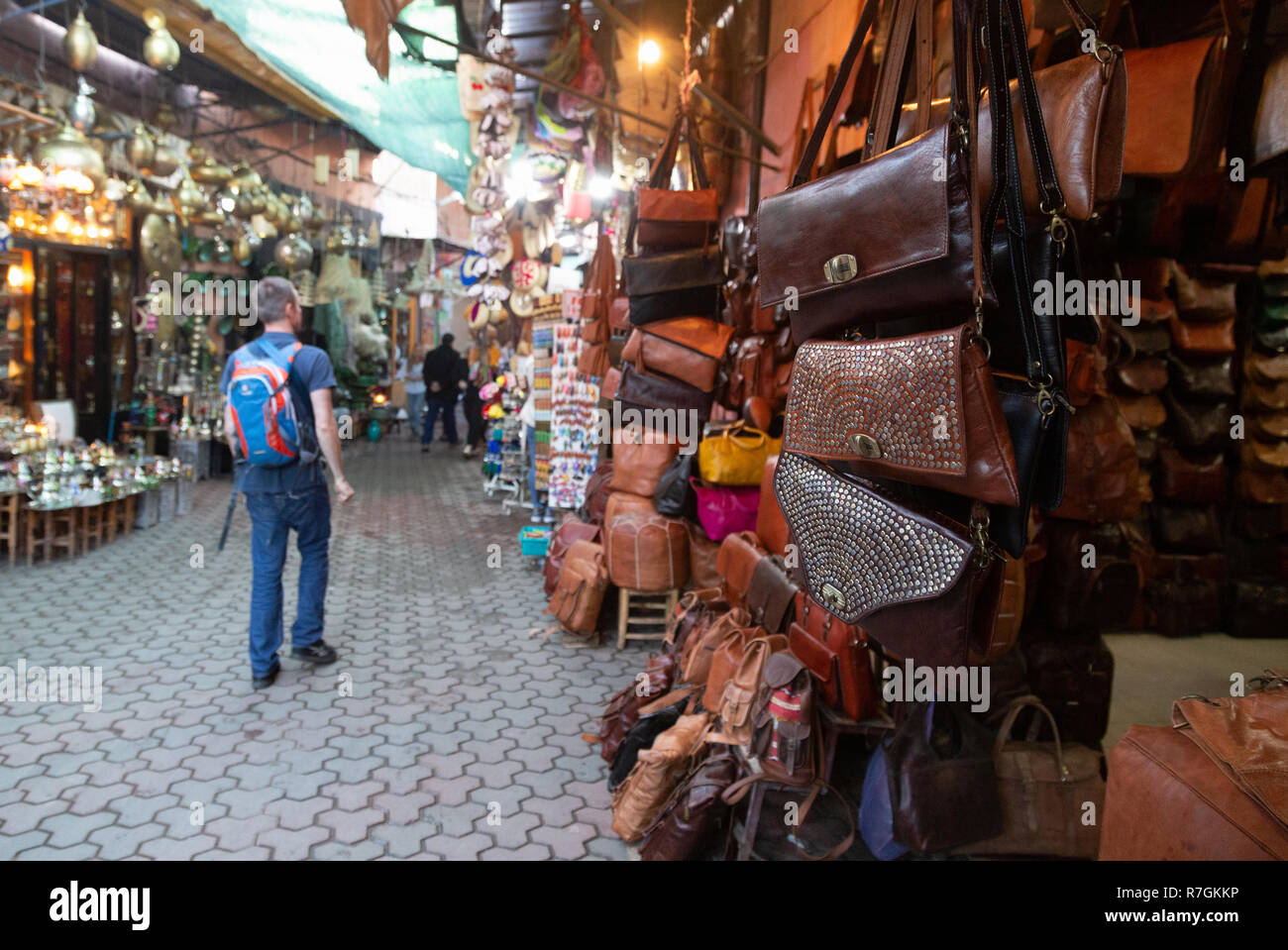 Tourist shopping in the souk, Marrakech Medina, Marrakesh, Morocco Africa Stock Photo