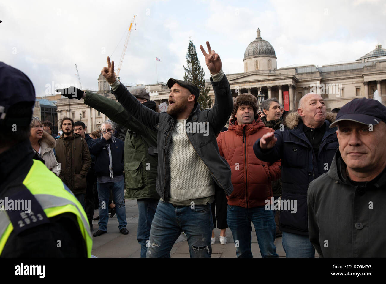 Demonstrators on the opposing side of the arguement at the ‘Oppose Tommy Robinson, unite against racism & fascism’ counter demonstration organised for anti-fascist groups opposed to far right politics, regardless of their positions on leave/remain on Brexit on 9th December 2018 in London, United Kingdom. Stock Photo