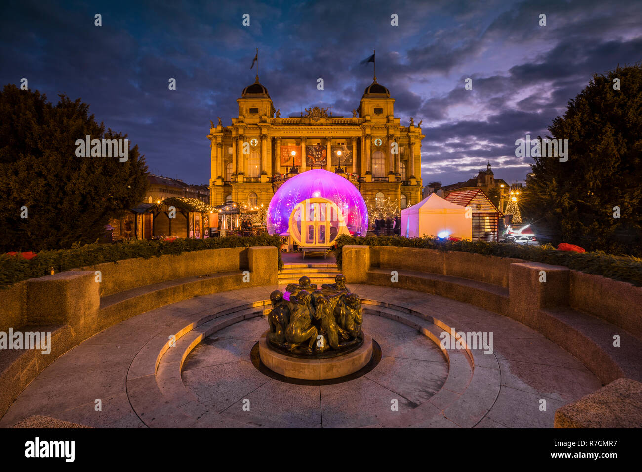 Zagreb Advent at night, Croatian National Theatre and The Well of Life is a sculpture by Ivan Mestrovic Stock Photo