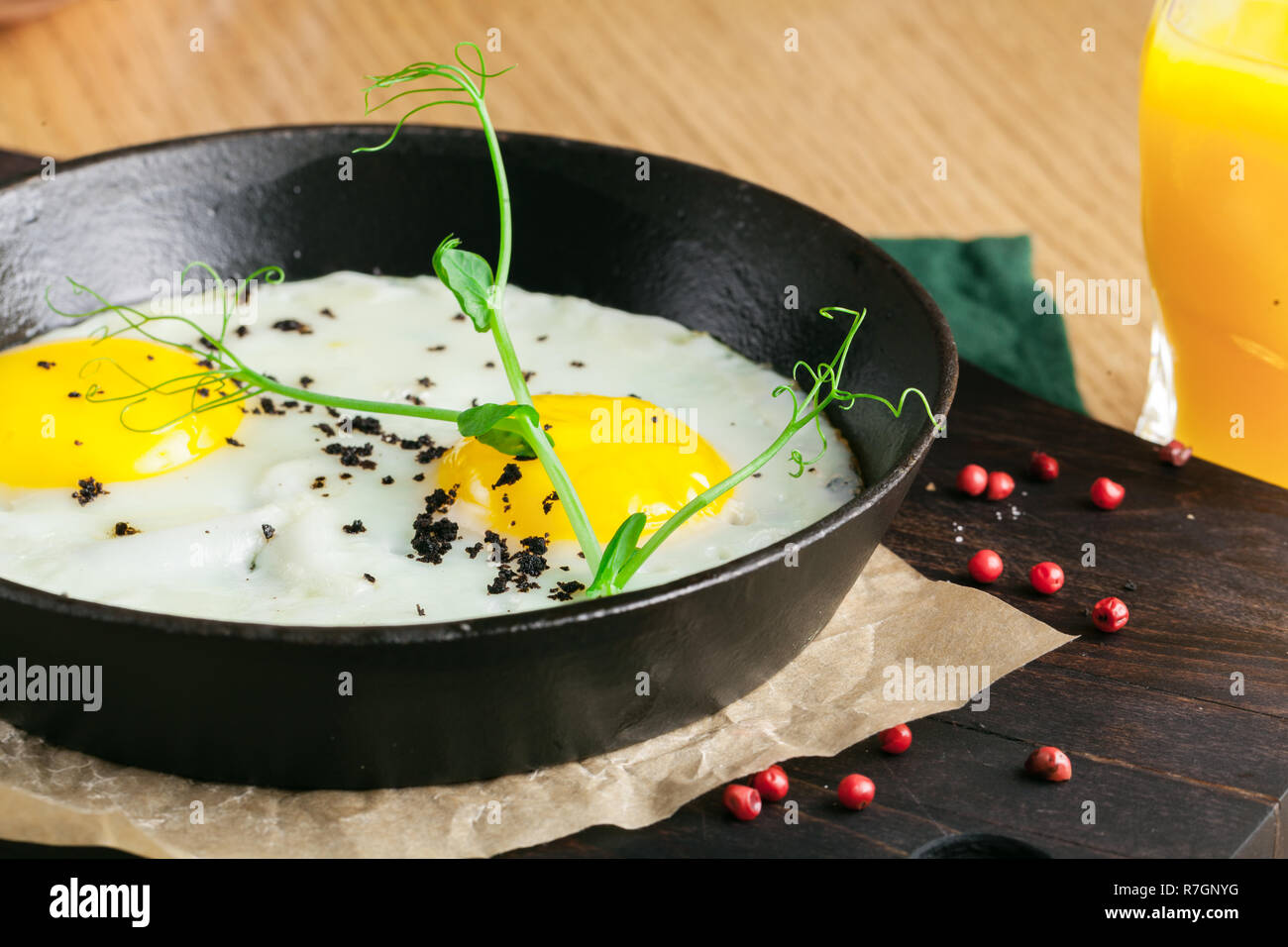 Eating restaurant delicious breakfast with sunny side up fried eggs