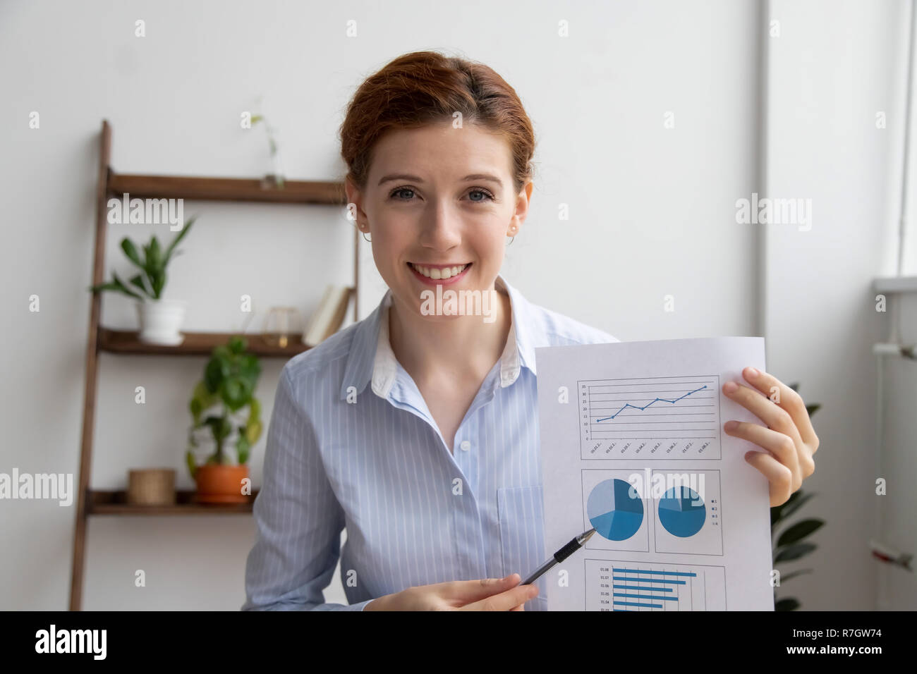 Business woman make financial report by video call using compute Stock Photo