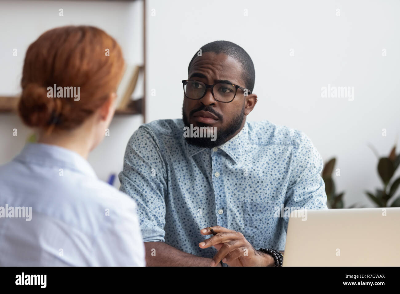 Boss listening candidate female consider her unsuitable for job  Stock Photo