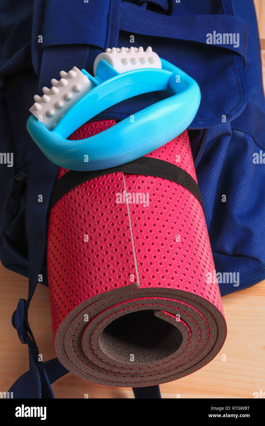 Pink Yoga Mat And Body Massager In A Blue Gym Bag Set For Fitness