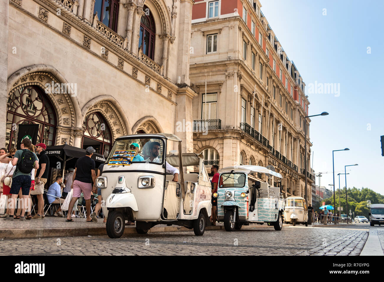 Lisbon, Portugal - July 9th, 2018: Auto rickshaw or tuk -tuk parked waiting for passenger at the center of Lisbon, Portugal. Stock Photo