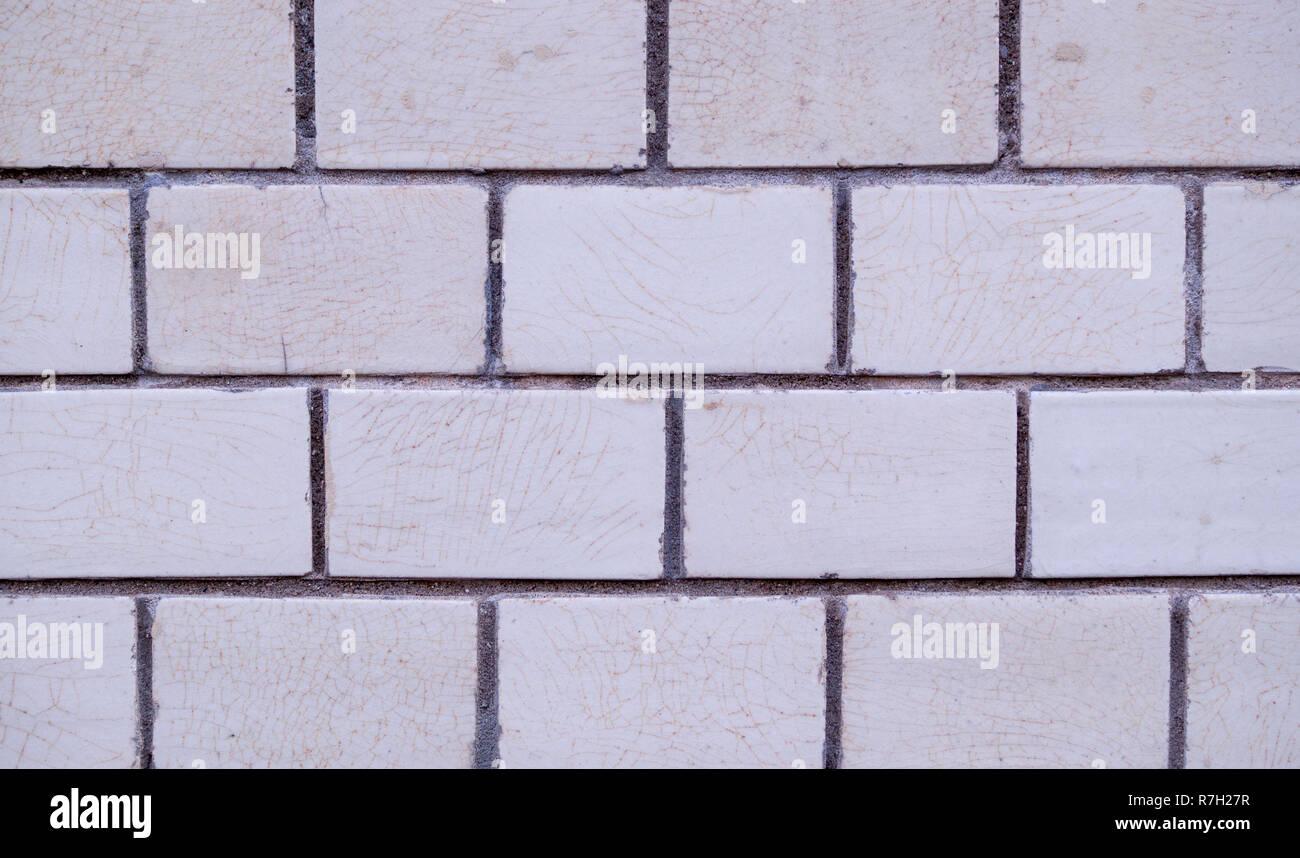 white decorative marble tiled brick wall. background, texture. Stock Photo