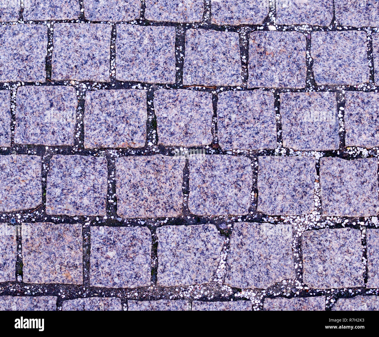 gray cobblestone tiled sidewalk pavement. background, texture. Stock Photo