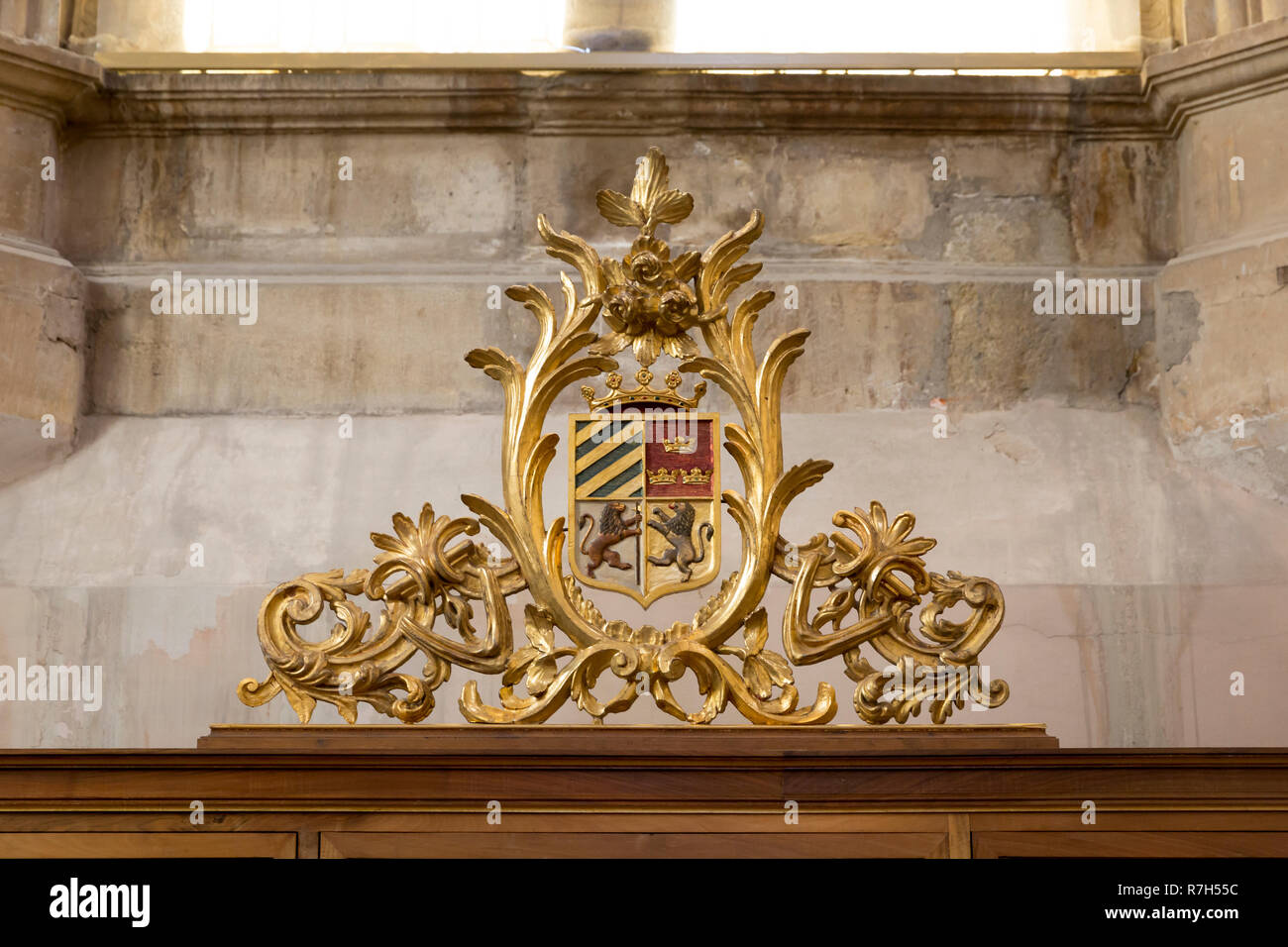 León, Spain: Ornate pediment with coat-of-arms on display in the library of the museum of San Isidoro Royal Collegiate Church. Stock Photo