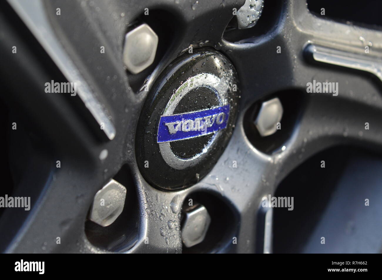 close up Volvo alloy wheel with water droplets Stock Photo