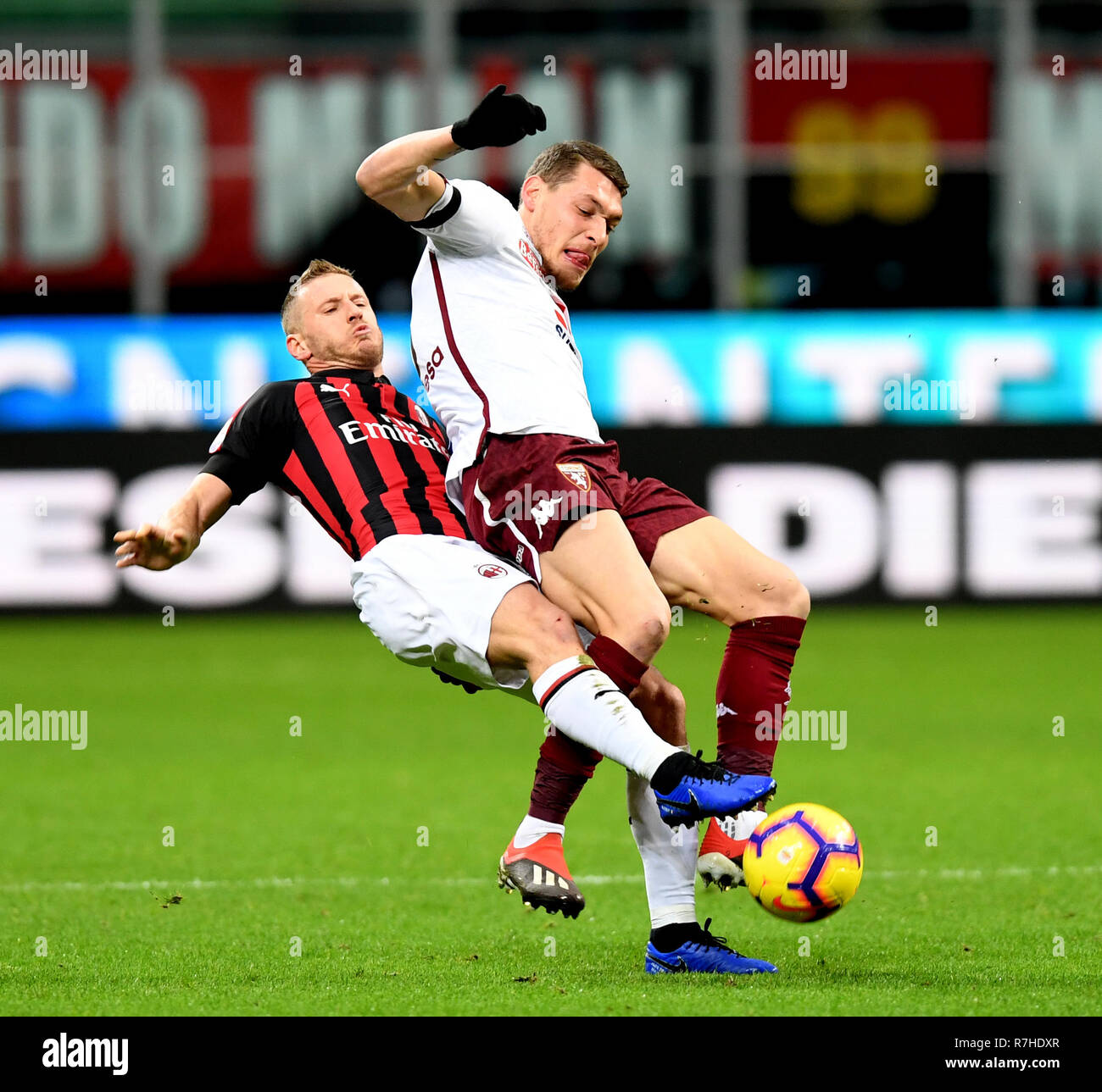 Milan, Italy. 9th Dec, 2018. AC Milan's Ignazio Abate (L) vies with Torino's Andrea Belotti during the Serie A soccer match between AC Milan and Torino in Milan, Italy, Dec. 9, 2018. The match ended in a 0-0 draw. Credit: Alberto Lingria/Xinhua/Alamy Live News Stock Photo