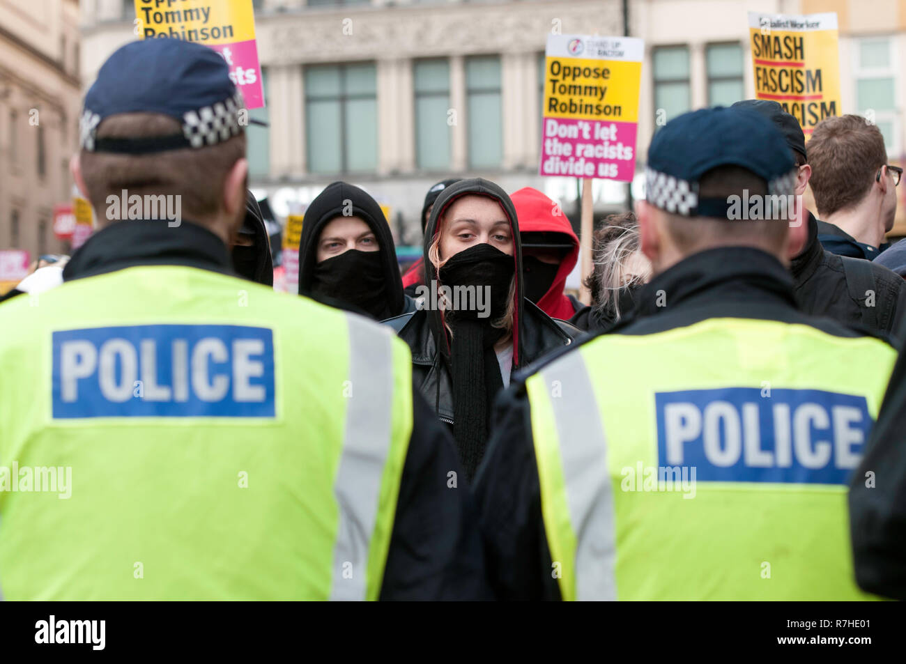 Police cordon seen in front of counter protesters during a demonstration against the 'Brexit Betrayal March'.   Thousands of people took to the streets in central London to march against the 'Brexit Betrayal March' organised by Tommy Robinson and UKIP. Counter Protesters made their way from Portland Place to Whitehall, where speakers addressed the crowd. During the counter demonstration, there was a strong police presence. A group of counter protesters, who became separated from the main protest, were corralled by police to avoid an encounter with a group of Tommy Robinson / UKIP supporters. Stock Photo