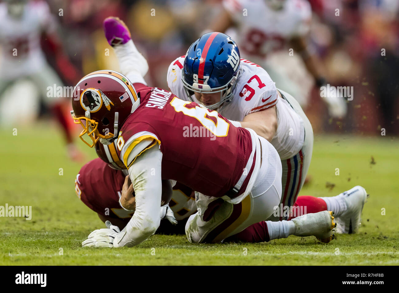 Landover, USA. August 24, 2018: Washington Redskins cornerback Prince  Charles Iworah (47) breaks up a pass intended for Denver Broncos wide  receiver Mark Chapman (85) during the NFL preseason game between the