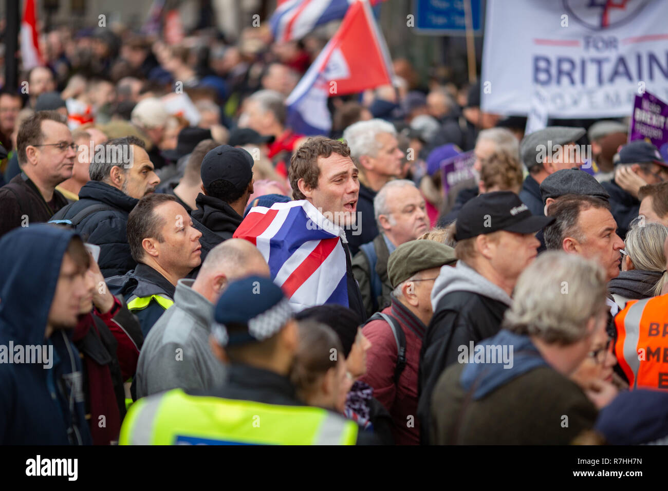 London, UK. 9th Dec, 2017. A pro-Brexit demonstrator draped in a Union Jack flag during the rally down Park Lane. EDL founder Tommy Robinson leads the way at the 'Brexit Betrayal' march backed by right wing political party UKIP.3,000 Pro-Brexit demonstrators and 15,000 Anti-Facist counter demonstrators took to the streets of London to voice their stance on the deal ahead of the key Brexit vote in parliament this Tuesday. Credit: Ryan Ashcroft/SOPA Images/ZUMA Wire/Alamy Live News Stock Photo