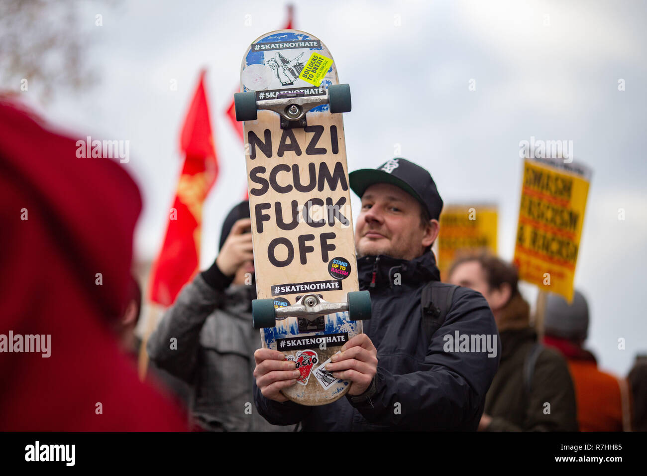 London, UK. 9th Dec, 2017. An Anti-Facist demonstrator holds up a protest skateboard during the rally. 3,000 Pro-Brexit demonstrators and 15,000 Anti-Facist counter demonstrators took to the streets of London to voice their stance on the deal ahead of the key Brexit vote in parliament this Tuesday. Credit: Ryan Ashcroft/SOPA Images/ZUMA Wire/Alamy Live News Stock Photo