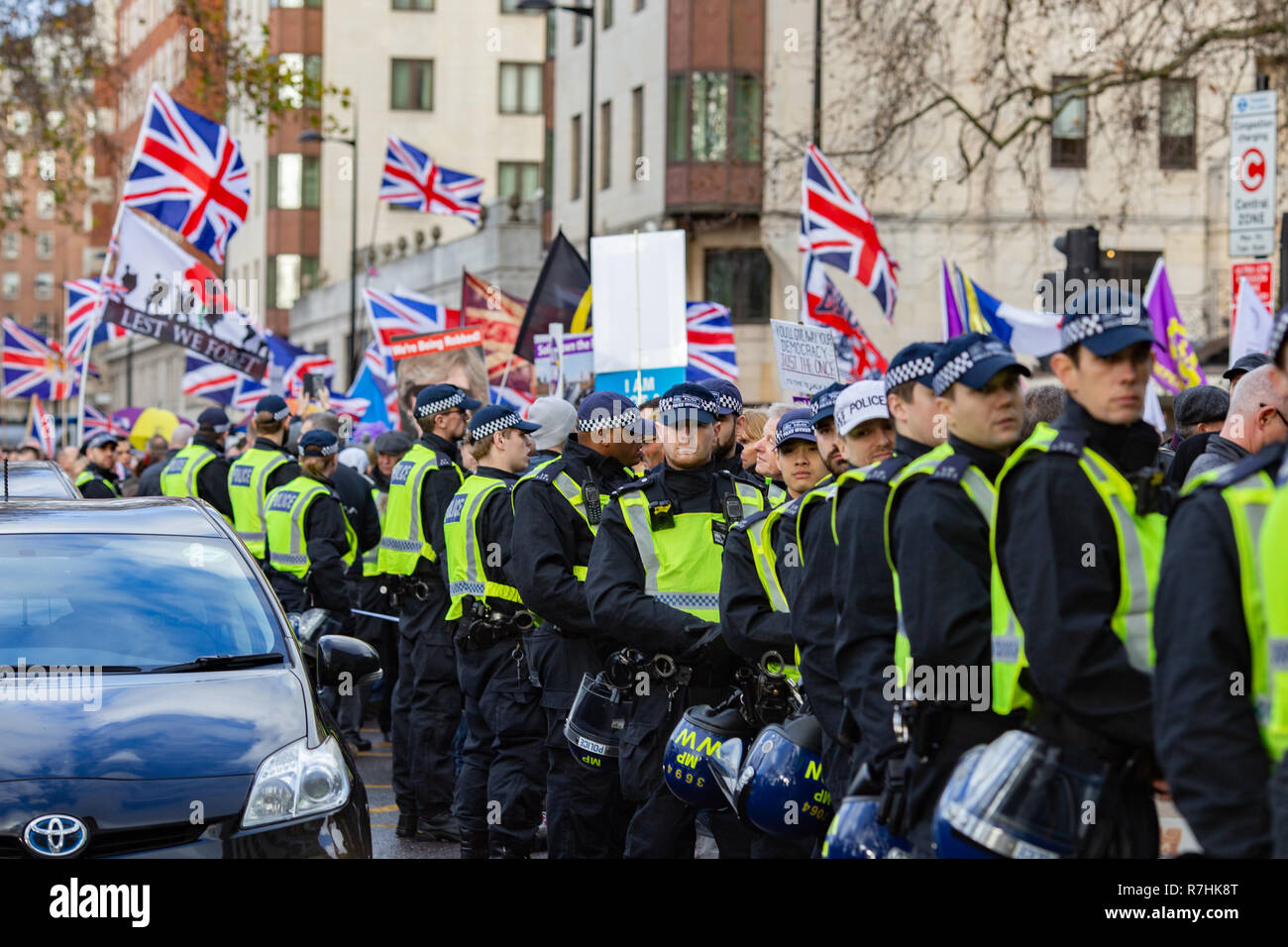Police contain the crowd at the Pro-Brexit march.   3,000 Pro-Brexit demonstrators and 15,000 Anti-Facist counter demonstrators took to the streets of London to voice their stance on the deal ahead of the key Brexit vote in parliament this Tuesday. Stock Photo