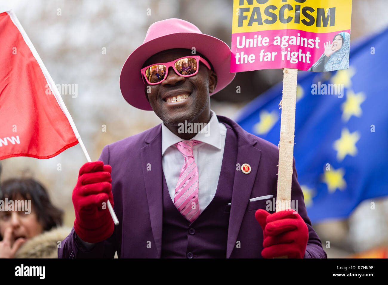 An Anti-Facist demonstrator holds up a 'unite against the far right' sign.   3,000 Pro-Brexit demonstrators and 15,000 Anti-Facist counter demonstrators took to the streets of London to voice their stance on the deal ahead of the key Brexit vote in parliament this Tuesday. Stock Photo