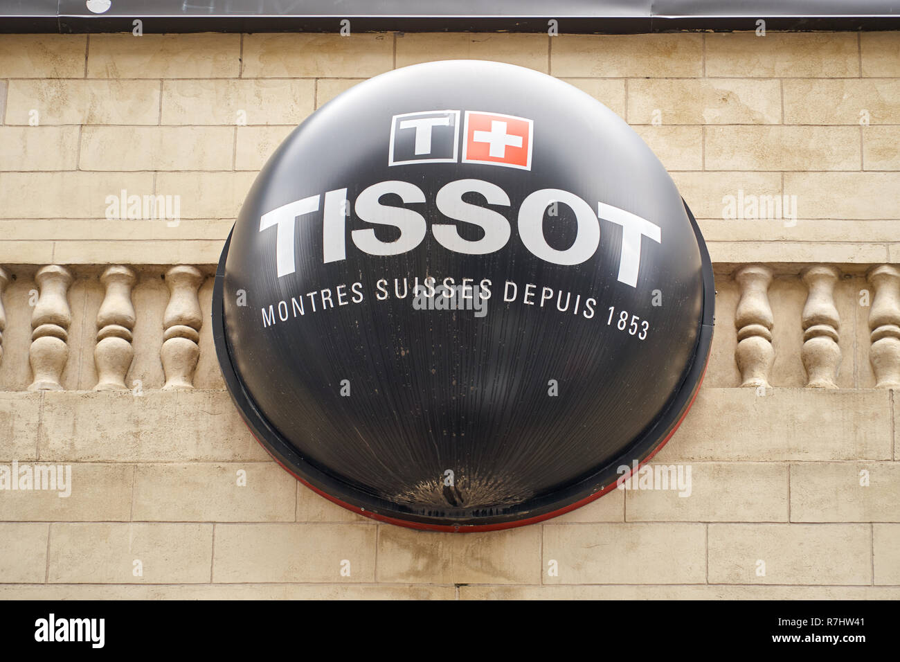 MONTREAL, CANADA - OCTOBER 4, 2018: Tissot logo and sign on a building. Tissot is a popular and famous Swiss luxury watchmaker. Stock Photo