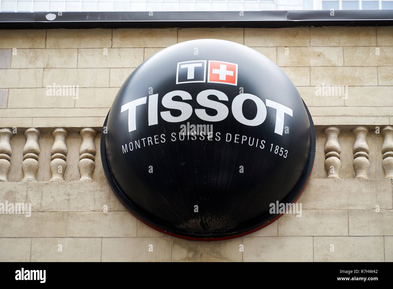 MONTREAL, CANADA - OCTOBER 4, 2018: Tissot logo and sign on a building. Tissot is a popular and famous Swiss luxury watchmaker. Stock Photo