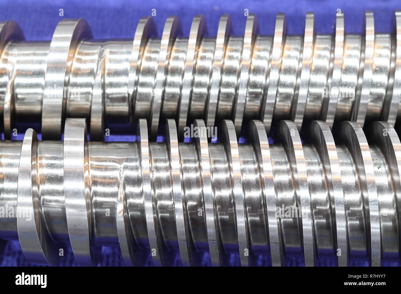Screw press parts for plastic injection machine ; selective focus Stock Photo