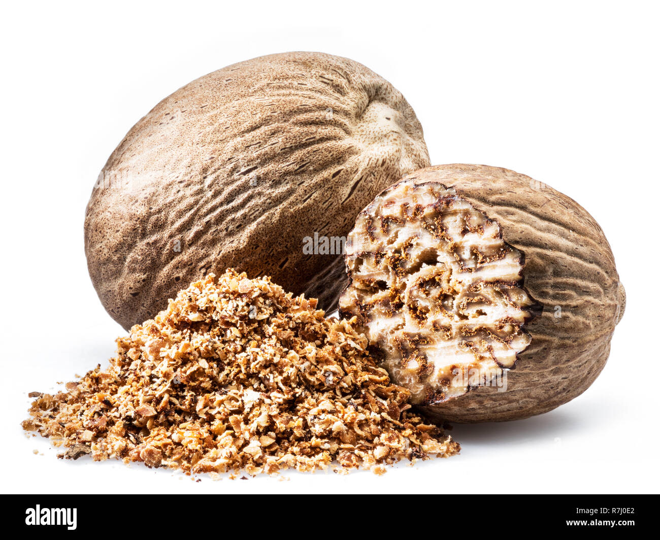 Dried seeds of fragrant nutmeg and grated nutmeg isolated on white ...