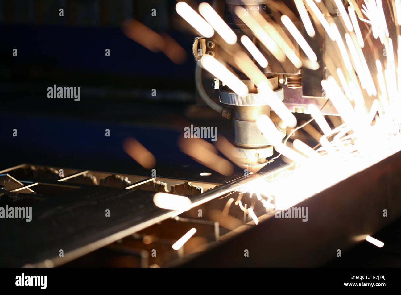 Sparks fly out machine head for metal processing Stock Photo