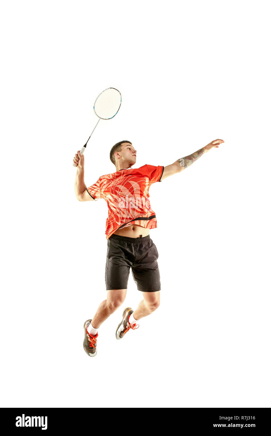 Young man playing badminton over white studio background. Fit male athlete  isolated on white. badminton player in action, motion, movement. attack and  defense concept Stock Photo - Alamy