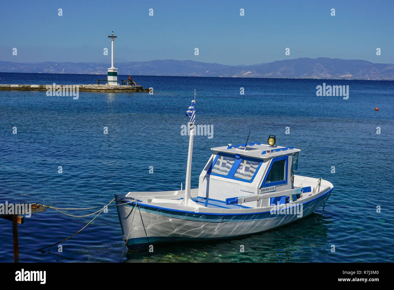 small Fishing boat at a pier in Kavala Harbor pier, East Macedonia, Greece Stock Photo