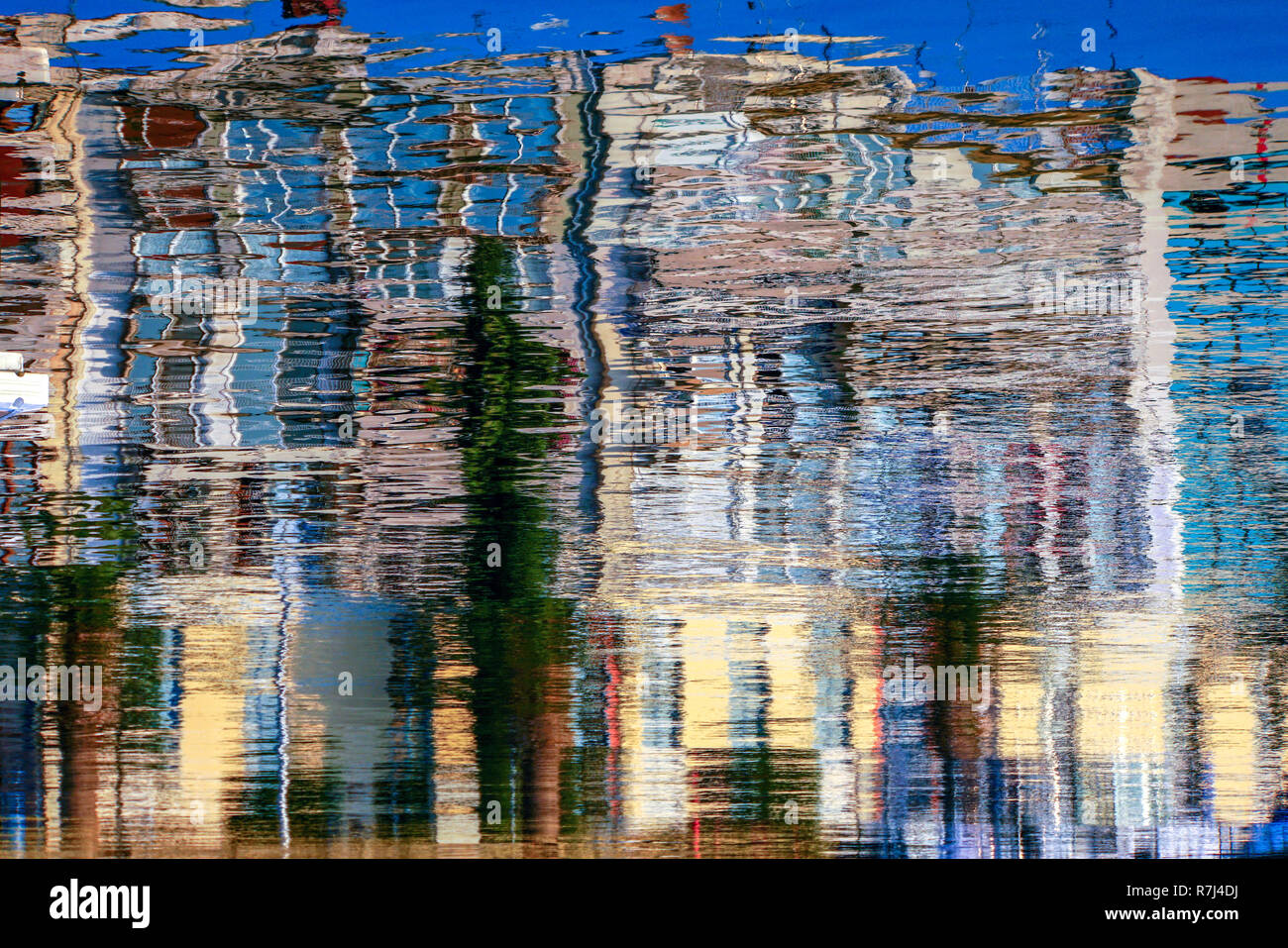 Boats reflecting in the water in a harbour Stock Photo - Alamy