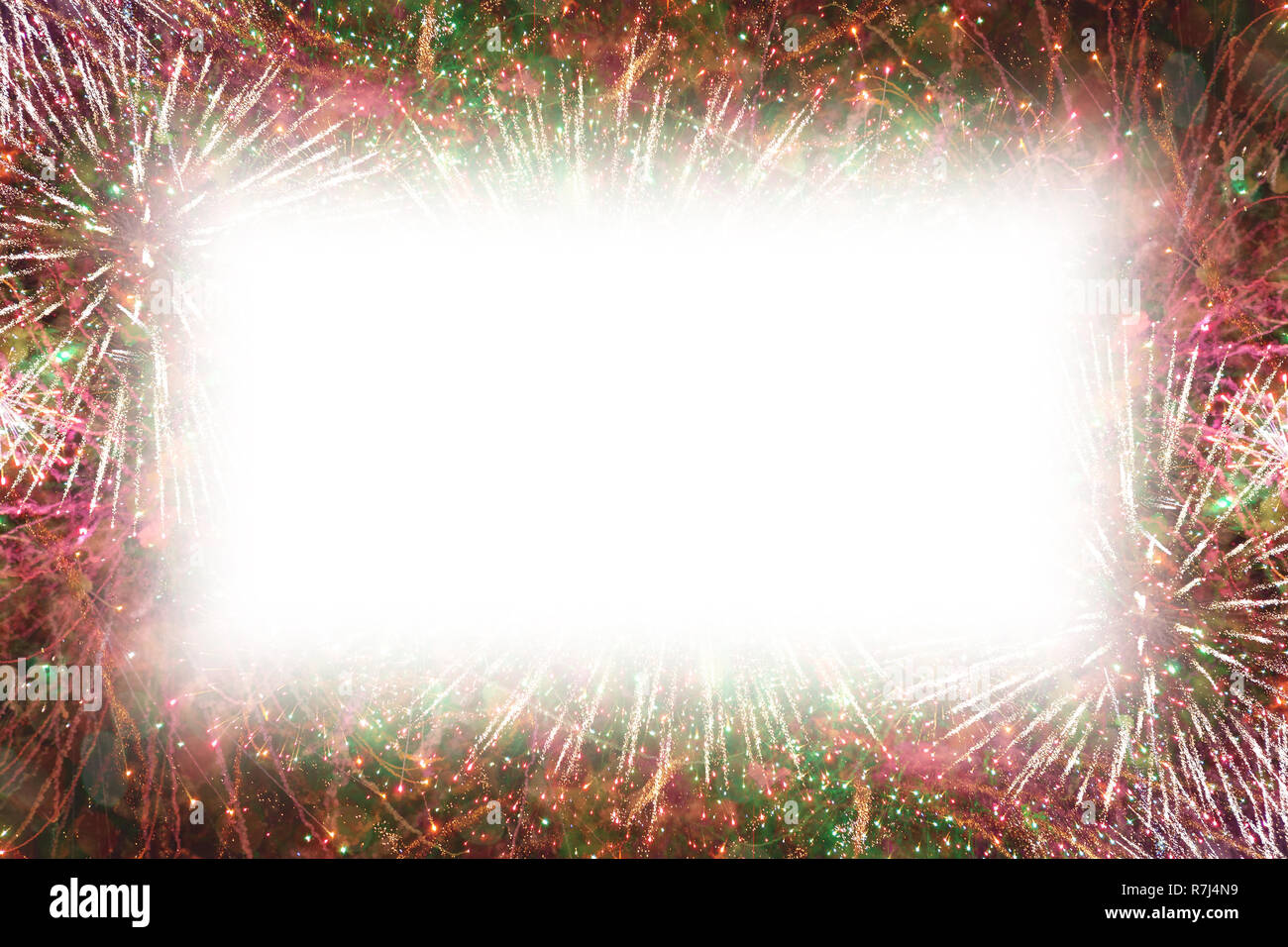 Colorful fireworks with white rectangle copy space in the middle Stock Photo