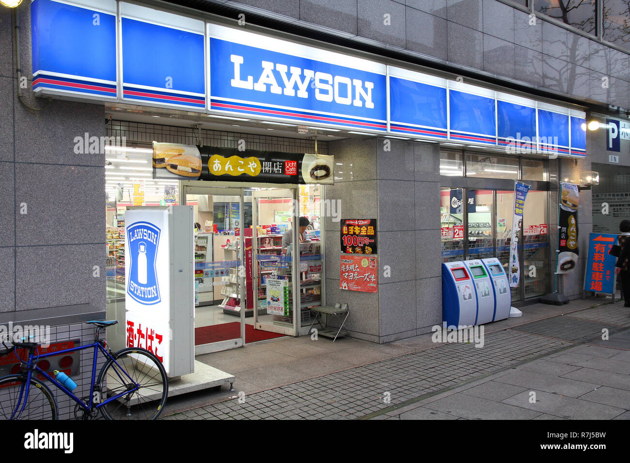 OKAYAMA, JAPAN - APRIL 22: Customers visit Lawson Station store on April 22, 2012 in Okayama, Japan. Lawson is one of largest convenience store franch Stock Photo
